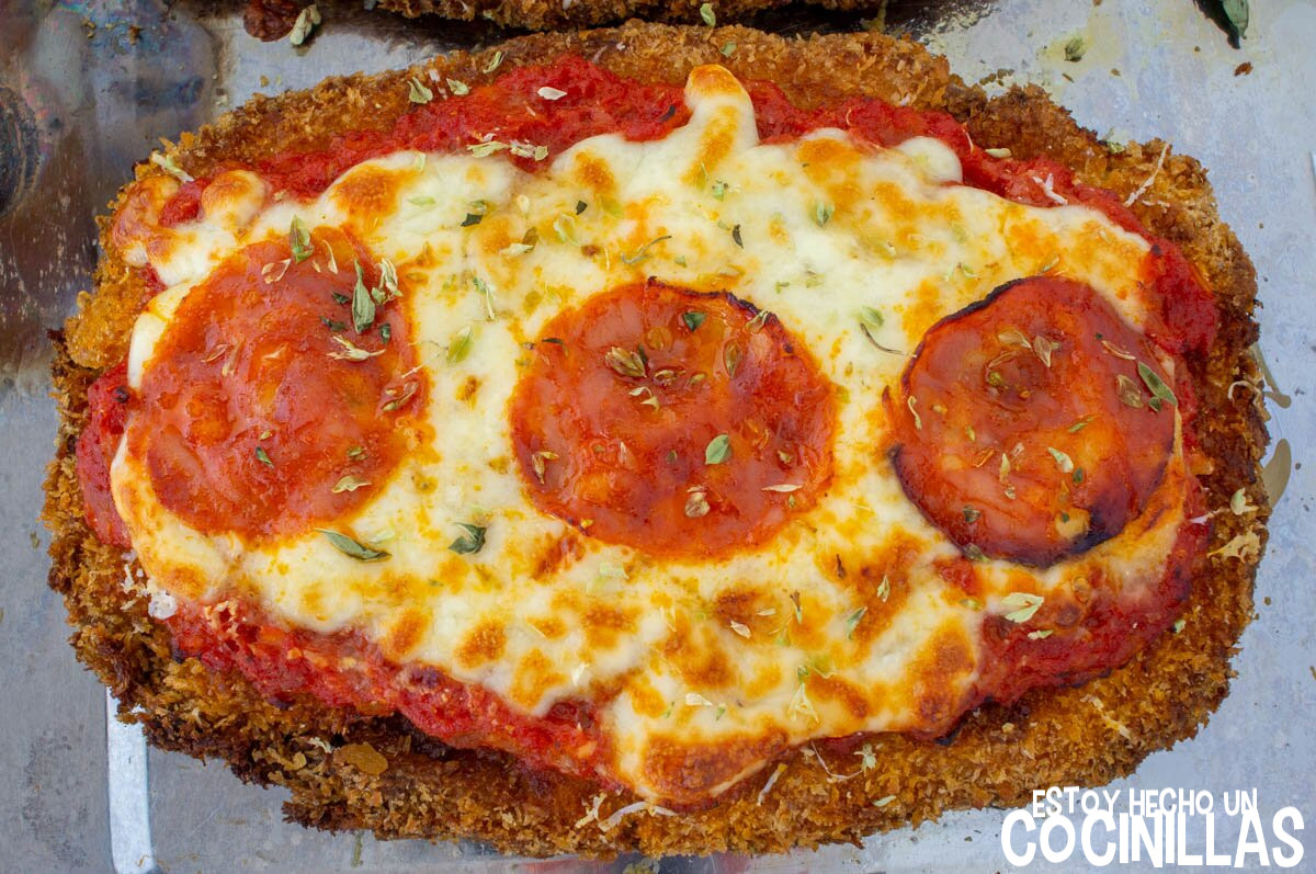 Hornear las milanesas a la pizza